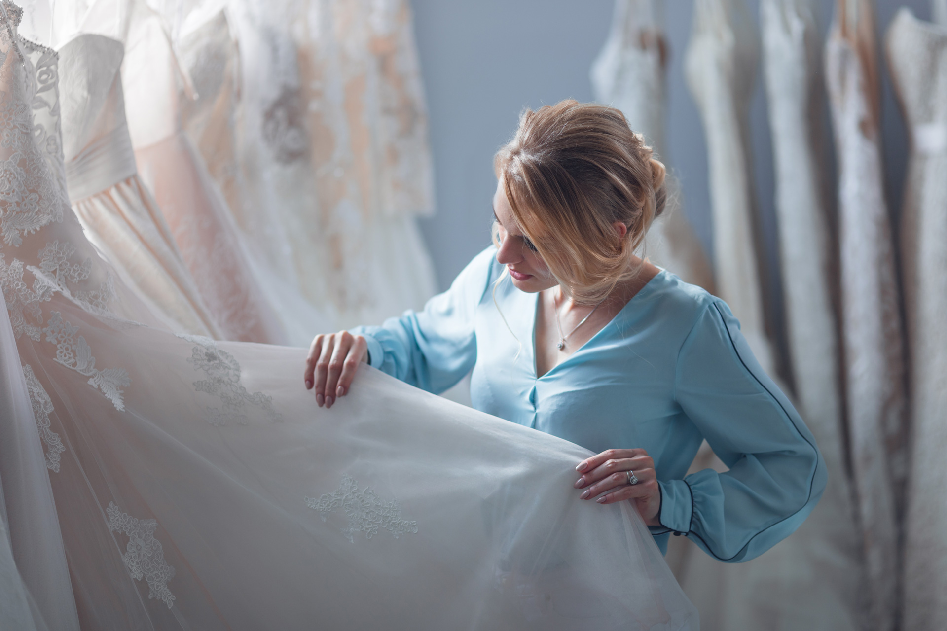 attractive girl chooses a wedding dress in the sto 2021 08 26 15 47 41 utc How many sizes can you alter a wedding dress?