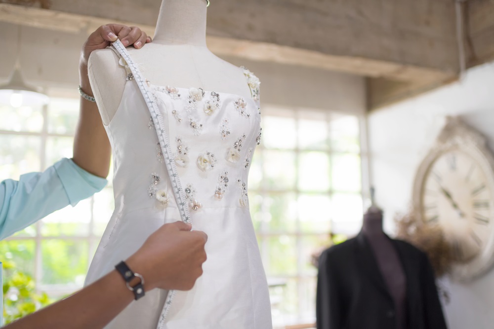 a Bride looking for a wedding dress alteration timeline during an alteration fitting session.